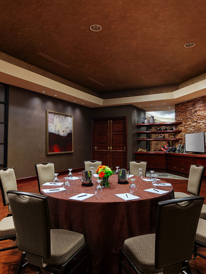 round table setting in a small room with greenish walls