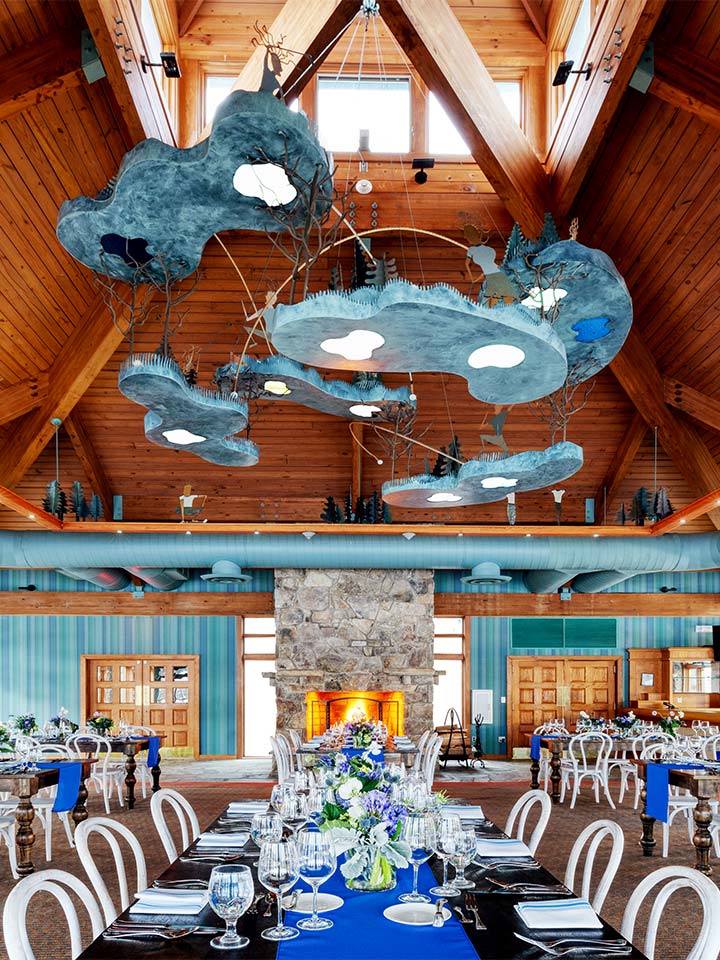 dining room with blue hanging chandelier