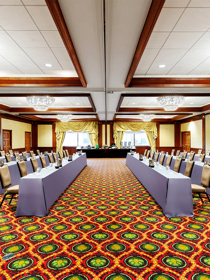large conference style room with tables facing each other