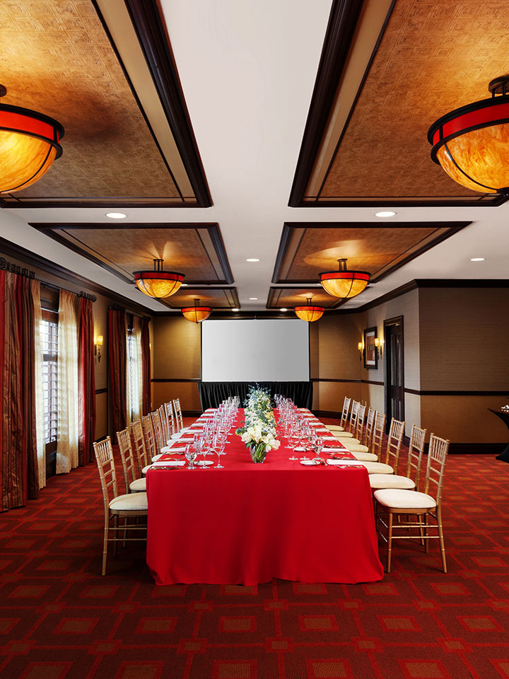 dining room with red table cloth and red carpet