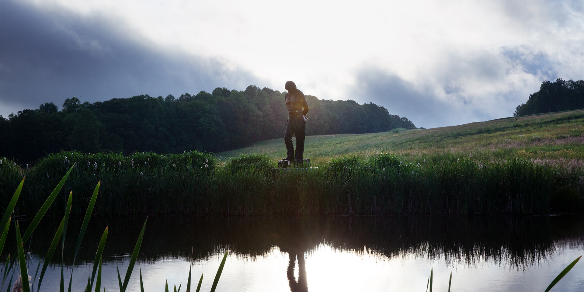 a person standing next to water outside
