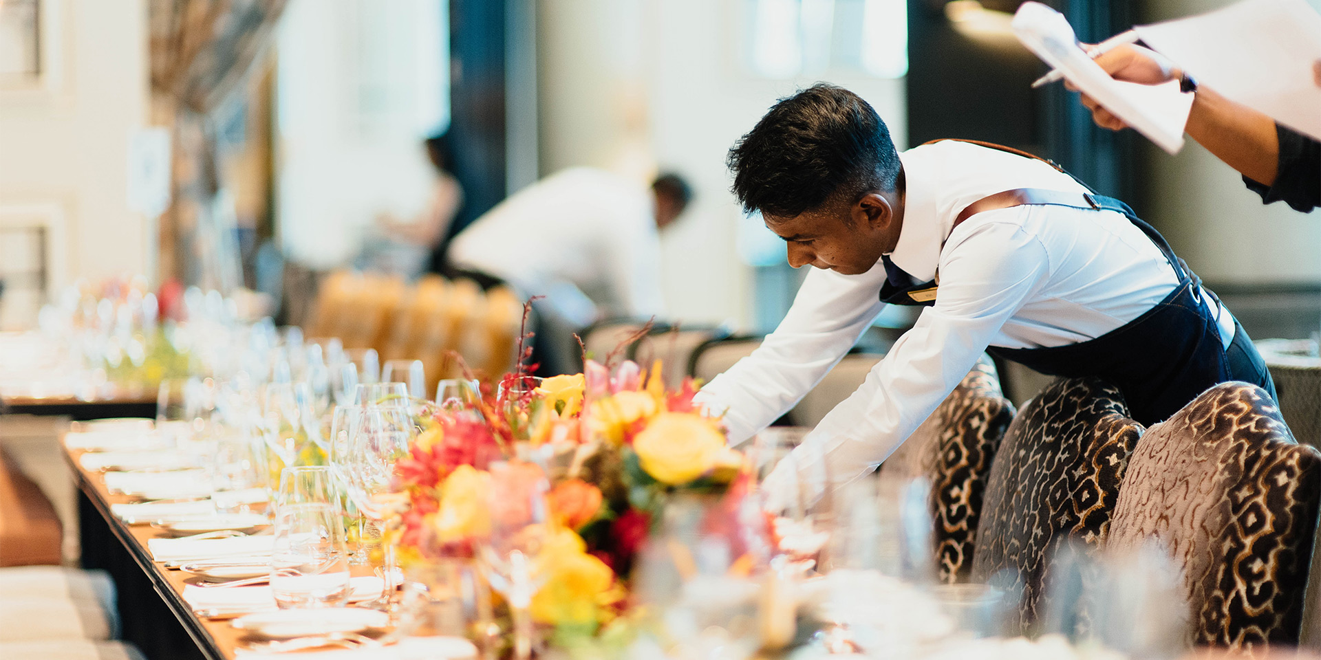 waiters setting a fancy table