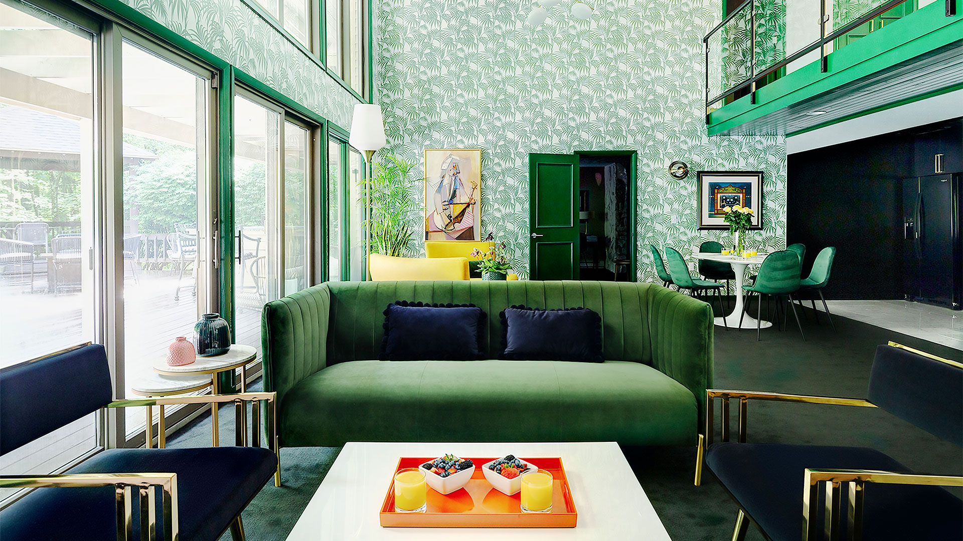 green room with green couch, green walls, and green door