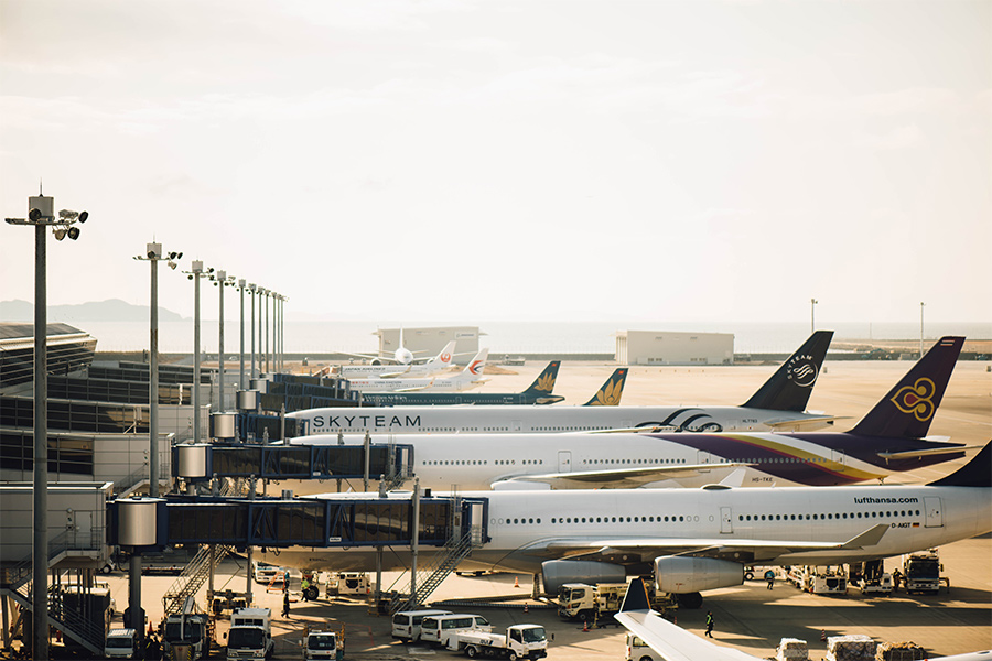 lineup of planes at an airport