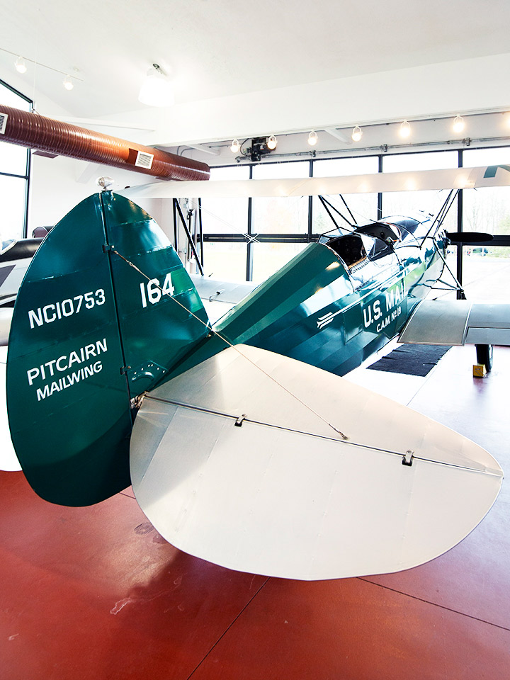 Indoor old fashioned green and white plane